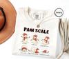 Pain Scale Christmas Shirt, Funny Snowman Holiday Tee, Nurse Gift Shirt, Medical Humor Winter Graphic T-Shirt, Cute Gift For Nurse