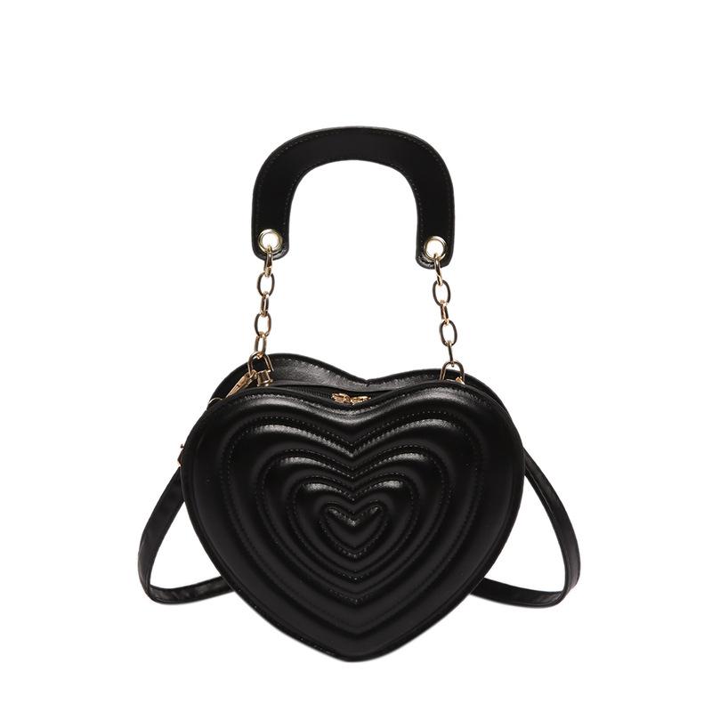 Сумка с углублениями 2024 года, новая модная сумка в форме сердца, милая модная сумка через плечо, однотонная сумка в форме сердца для девочек