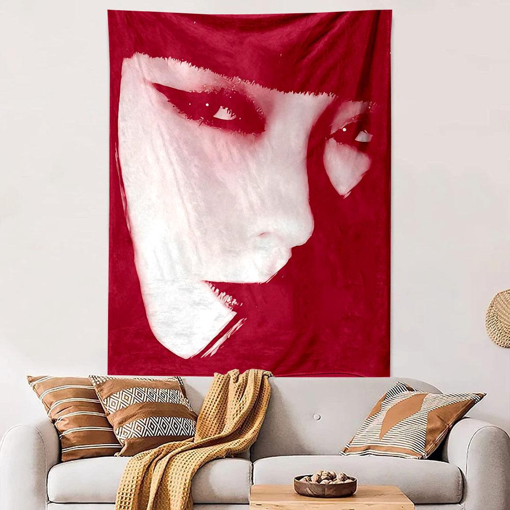 High-contrast close-up of a face with bold eyeliner and red tones. Patterned tapestry for bedroom and living room home decor