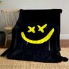 A yellow smiley face with X-shaped eyes on a black background. for all seasons blanket lunch break throw gift