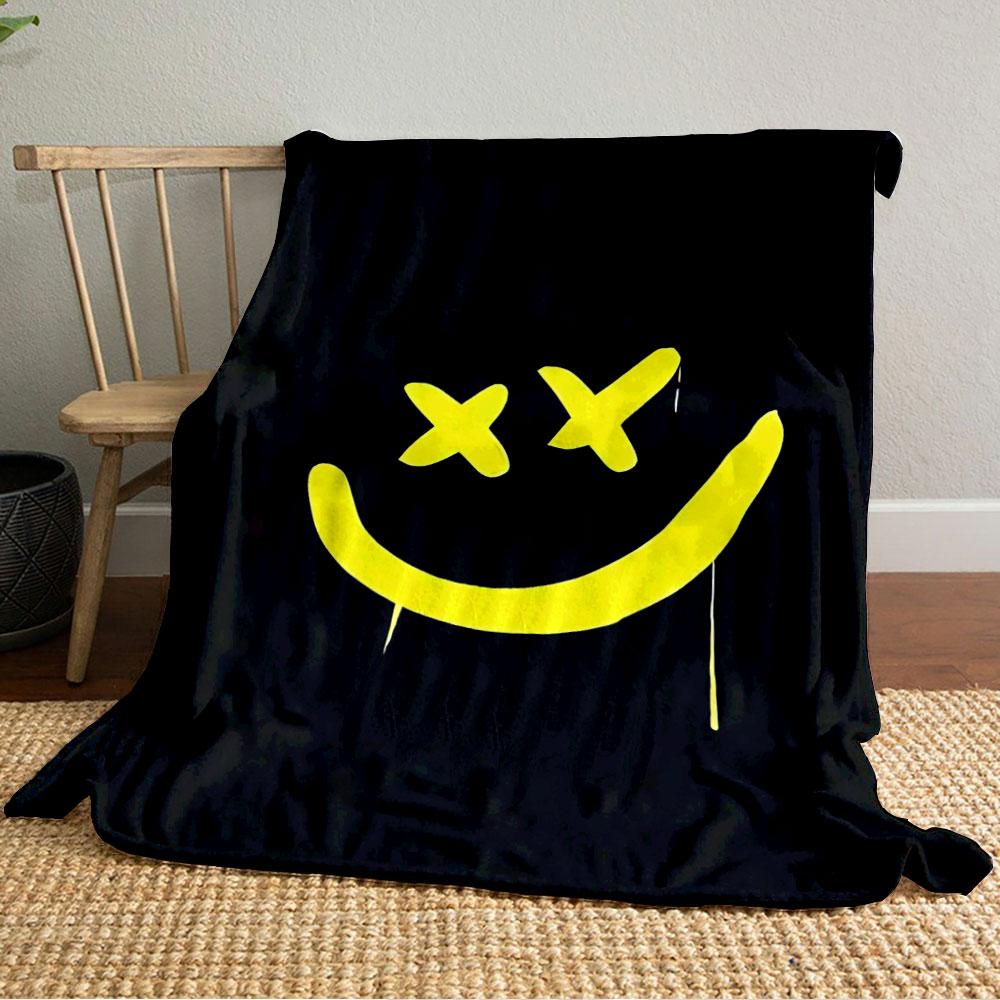 A yellow smiley face with X-shaped eyes on a black background. for all seasons blanket lunch break throw gift