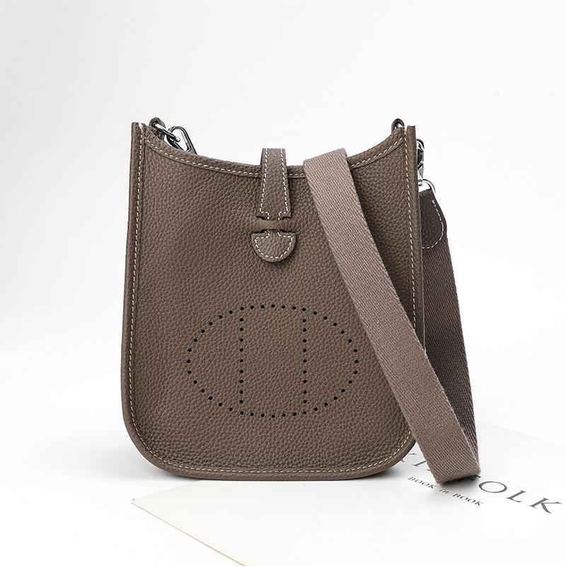 Фабричная оптовая продажа сумка-ведро из натуральной коровьей кожи первого слоя женская сумка с узором личи полый дизайн на одно плечо через плечо полый дизайн