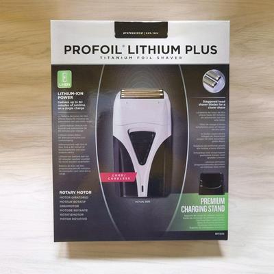 Электробритва, совместимая с Andis, с подставкой для зарядки и толкателем бритвенной головки.