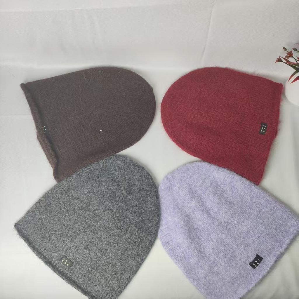 Trendy solid color versatile plus stacked hats show your face small cold hats autumn and winter warm ear protectors knitted wool hats