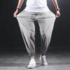 Эластичные повседневные брюки Ice Silk Быстросохнущие мужские летние тонкие спортивные брюки Fat Plus Fat для увеличения свободных ног Брюки Nine Point