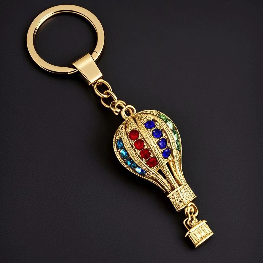 Золотой брелок в виде воздушного шара и гамбургера из сплава с семенами дыни и слитком песочного золота