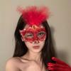 Cosmetic masquerade party with a sexy half-face makeup woman wearing a half-face erotic lace mask, a Halloween feather mask