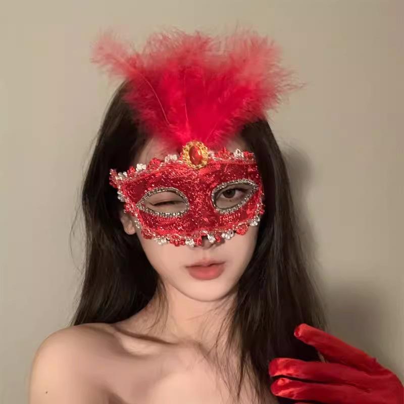 Cosmetic masquerade party with a sexy half-face makeup woman wearing a half-face erotic lace mask, a Halloween feather mask