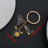 Ключница-брелок из черного денима в европейско-американском стиле с изображением бычьей головы, украшенная капельной эмалью, звездой и ботинками.