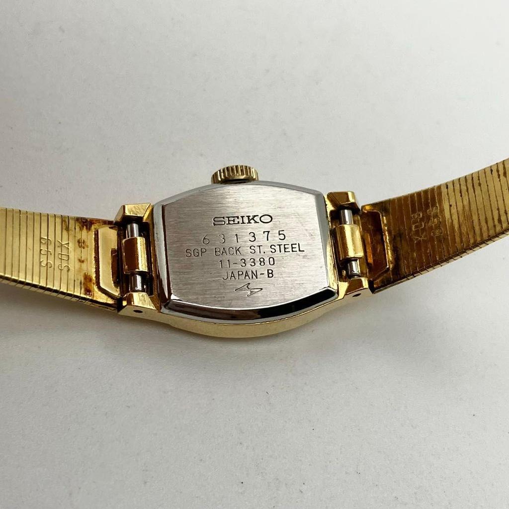 Использовались в хорошем рабочем состоянии женские наручные часы Seiko с ручным заводом, золотой корпус, зеленый циферблат