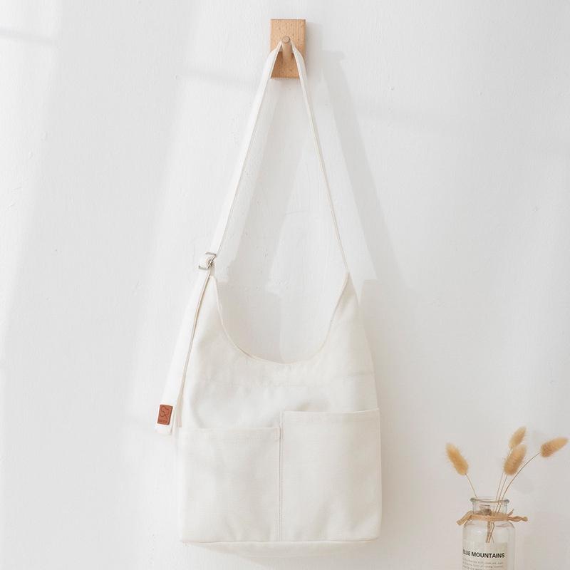 IELGY Large-capacity multi-pocket Japanese style simple messenger canvas bag women