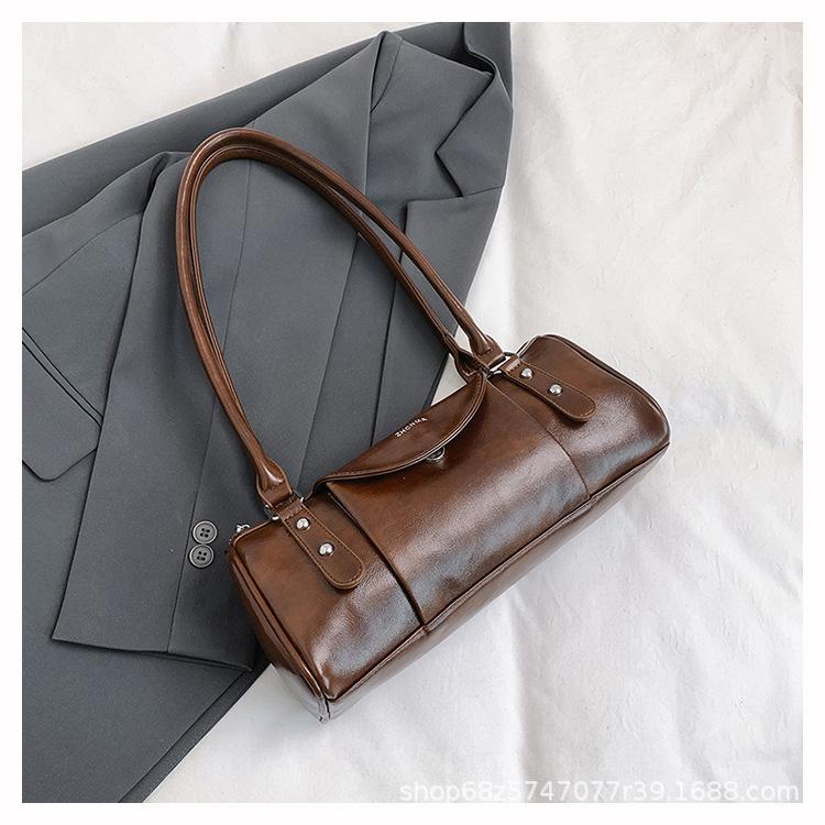 Retro high-end hand-held bowling bag women's 2025 new simple and fashionable shoulder bag versatile commuter messenger bag