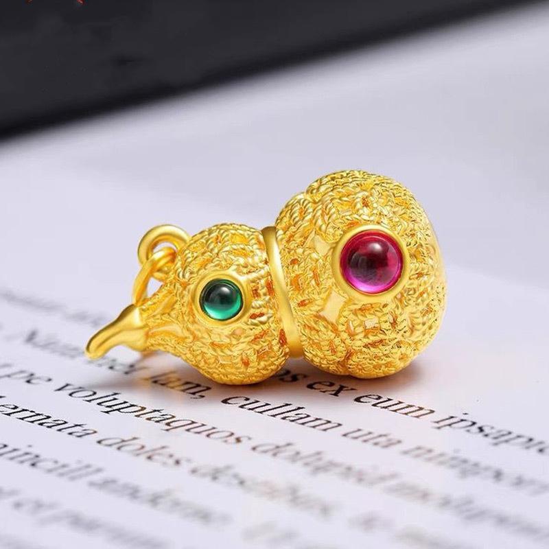 Подвеска в форме тыквы из 18-каратного золота Au750 с полым красным изумрудом и флоксом из золота