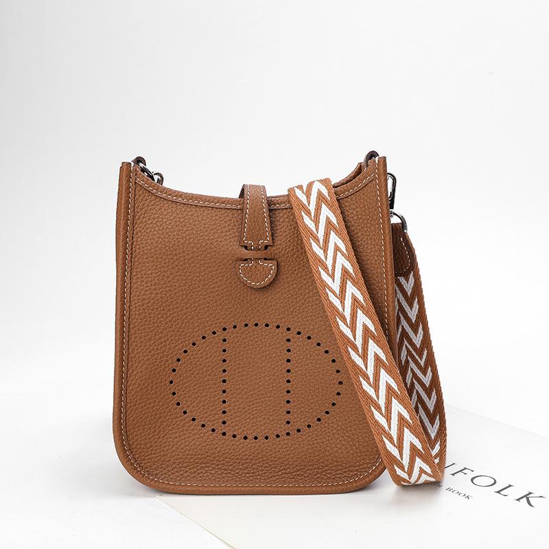 Фабричная оптовая продажа сумка-ведро из натуральной коровьей кожи первого слоя женская сумка с узором личи полый дизайн на одно плечо через плечо полый дизайн