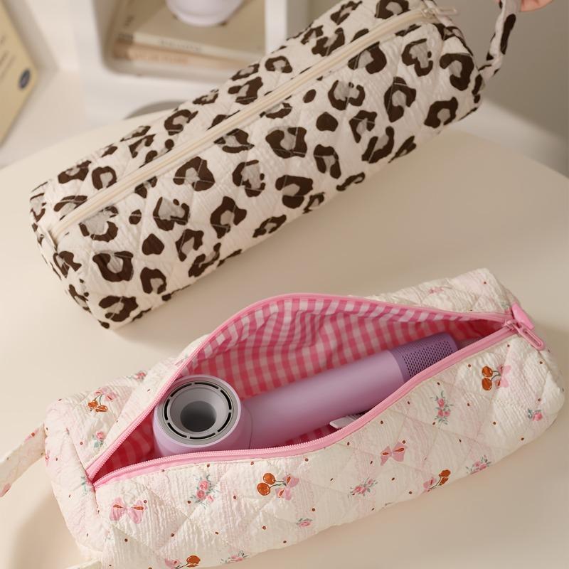 Bow-design hair tool storage bag with zipper. Dustproof for hair dryers and styling tools, ideal for travel and daily use.