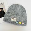 Color love cloth label knitted hat women, soft waxy vertical curled edge cold hat, sweet wool hat in autumn and winter
