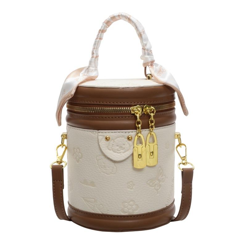High-quality New Products Cute Embossed Light Luxury High-end Portable Cylinder Bag Niche Design Versatile Temperament Messenger Women's Bag