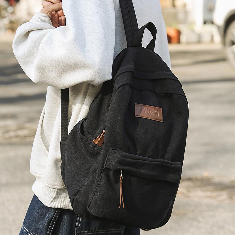 New denim canvas labeled fashionable four-season backpack Japanese and Korean casual large-capacity backpack