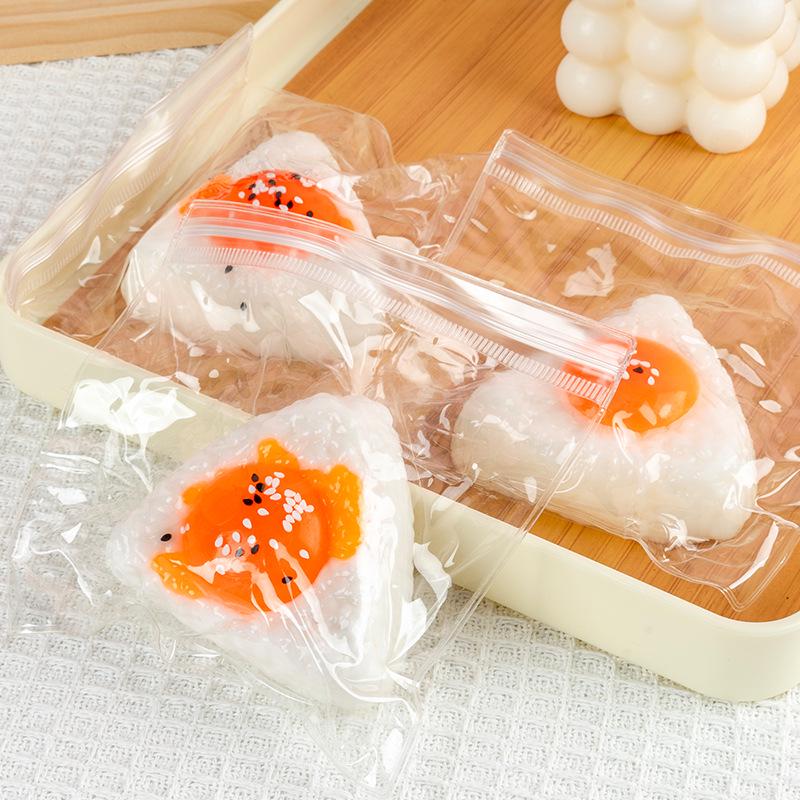 Игрушка-сквиши в виде рисового шарика с желтком - Креативный подарок для снятия стресса для студентов