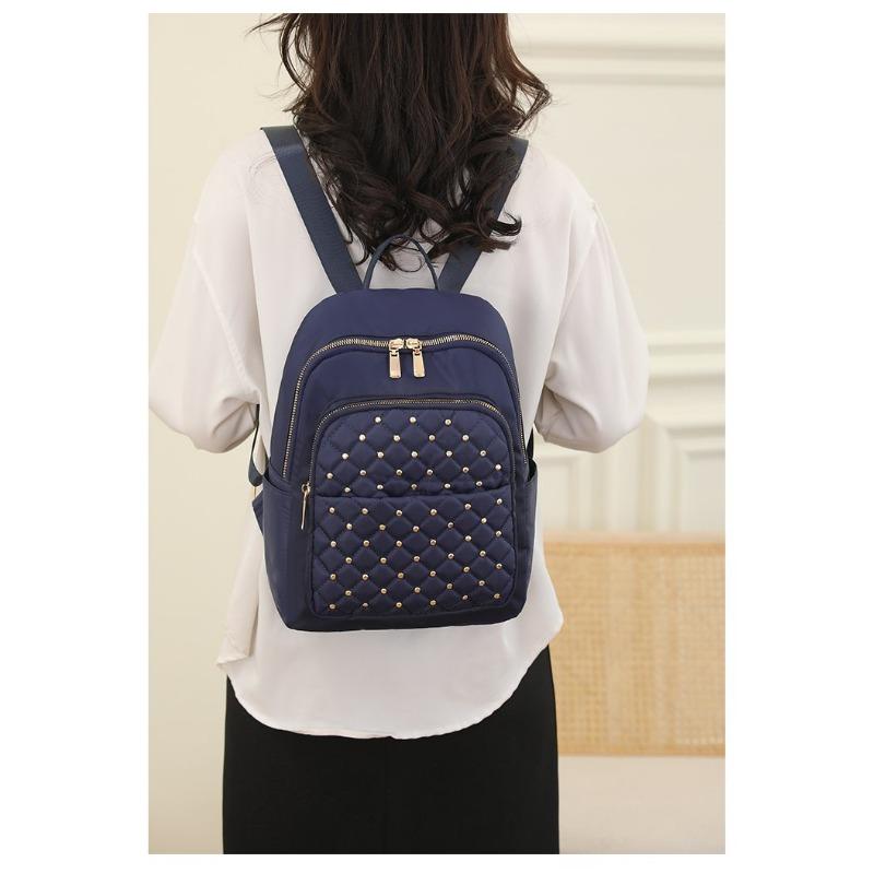 Сплошной цвет женский высококачественный водонепроницаемый рюкзак из ткани Оксфорд 2023 новый дизайнерский широкий плечевой ремень противоугонный дорожный рюкзак