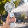 Portable Dual Nozzle Mist Handheld Fan Efficient Low Noise Design with Rechargeable Battery and Adjustable Airflow for Indoor Outdoor Use