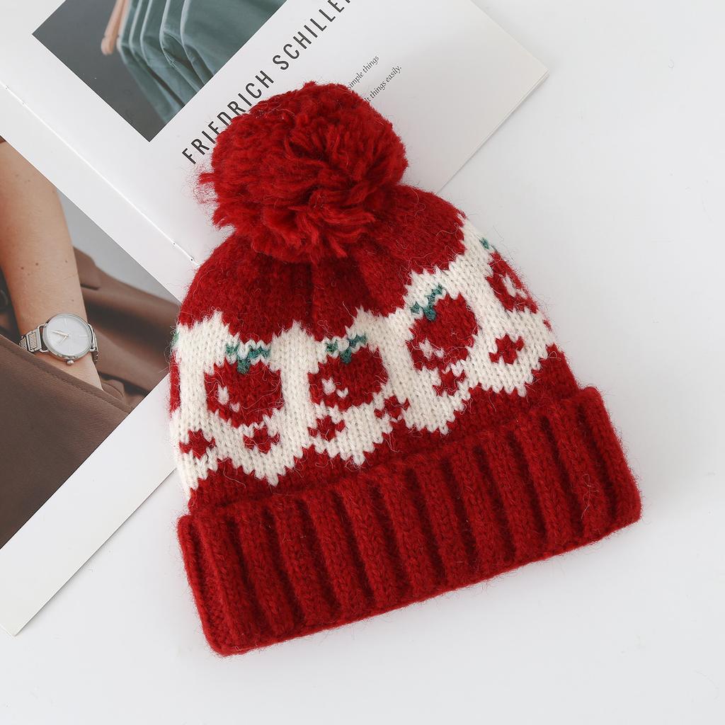 Fair Island wind red strawberry hairball wool hat women's autumn and winter cute cold and warm mountaineering ear protection knitted hat