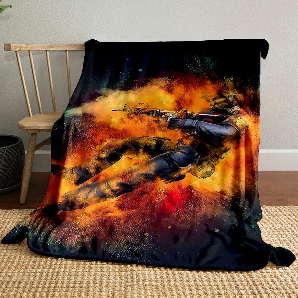 A soldier mid-action surrounded by fiery, explosive orange effects. for all seasons blanket lunch break throw gift