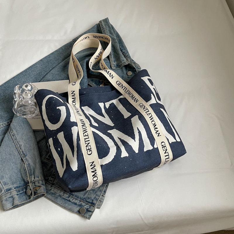 2025 Модная холщовая сумка Ленивый ветер Японская Большая вместимость Студенческая холщовая сумка Ремешок с алфавитом Сумка-тоут