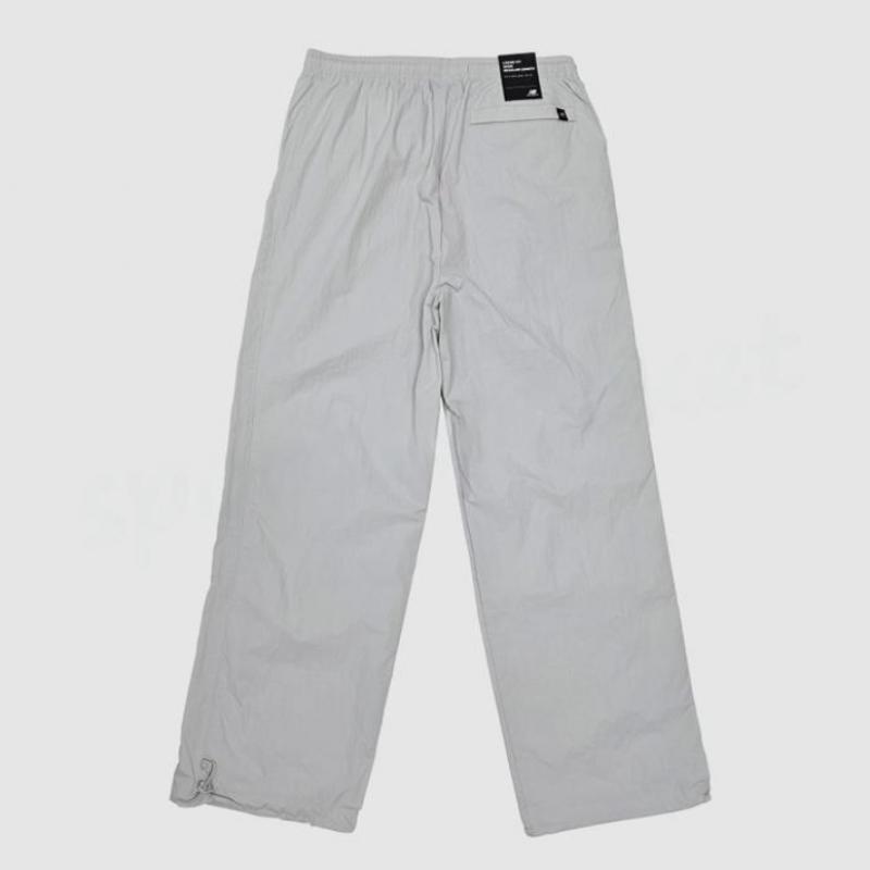 New Balance Унисекс Базовые нейлоновые брюки с логотипом Nbntc32703