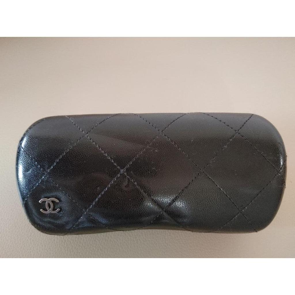 Б/у солнцезащитные очки CHANEL с камелией черные