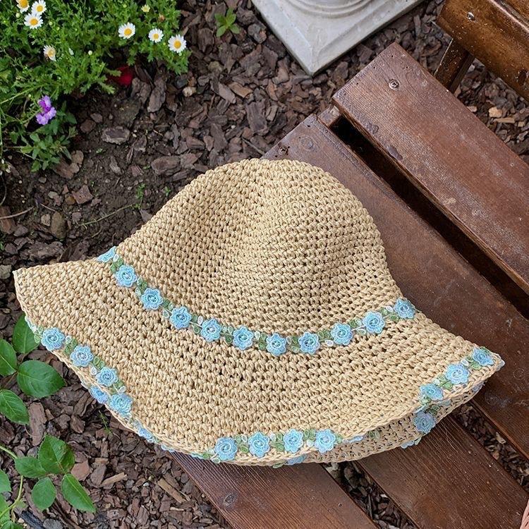 Mint Mambo flower woven bucket hat for sale in women's seaside resort area Big brim straw hat Foldable hat