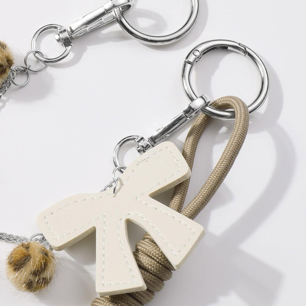 Стильный брелок для сумки в виде бантика из искусственной кожи для женщин с помпонами, кисточками и цепочкой для сумки через плечо для украшения