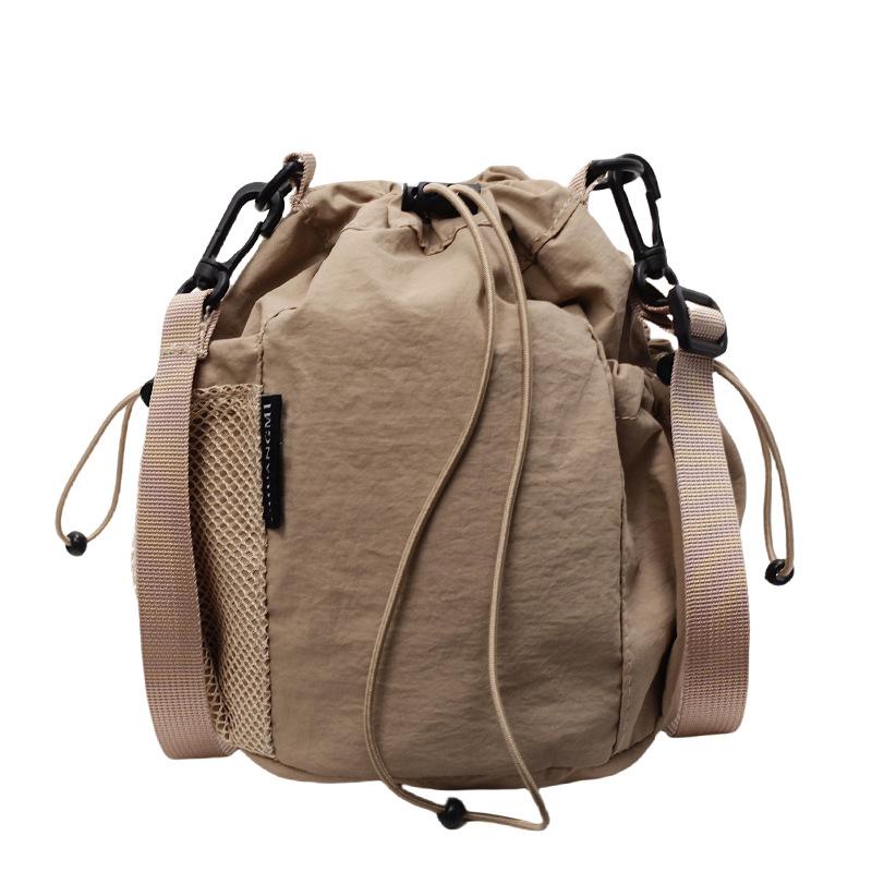 2025 New Japanese Leisure Niche Outdoor Sports Drawstring Bucket Bag Fashionable Versatile Light Travel Messenger Bag