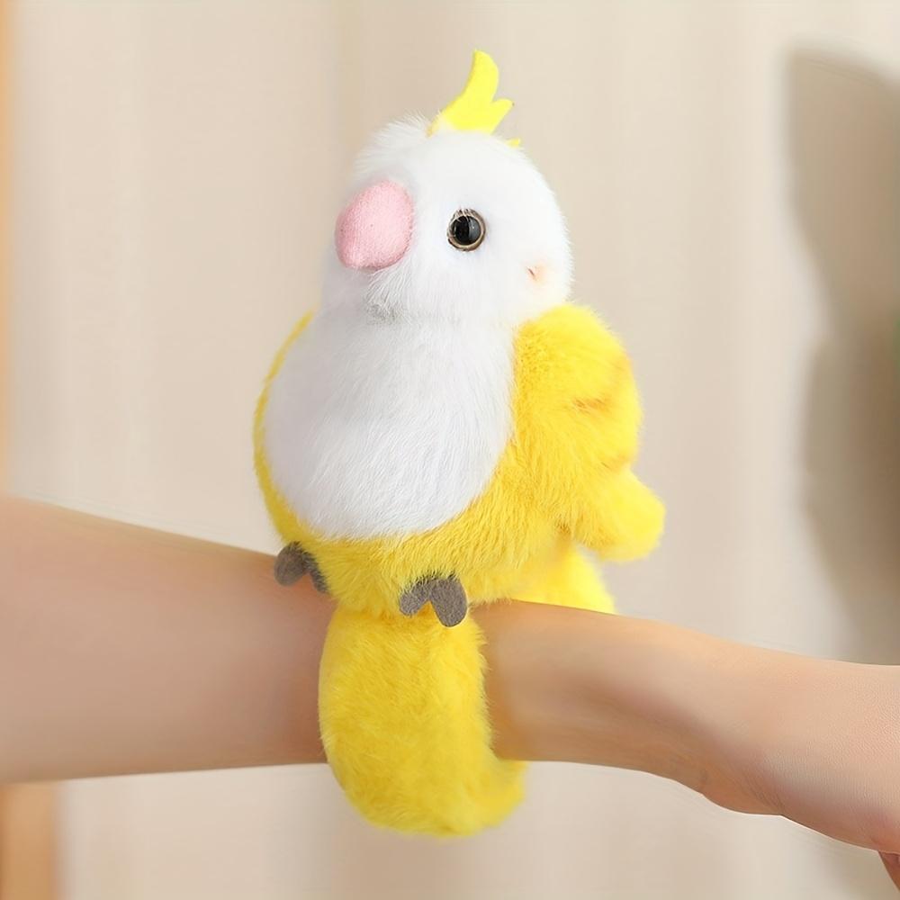 Cute parrot plush wristband with snap closure. Colorful bird-shaped wearable toy for kids, lovely collectible accessory.