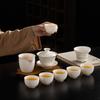 Dehua suet jade porcelain tea set is a complete set of gold-painted white porcelain household tea making utensils Company