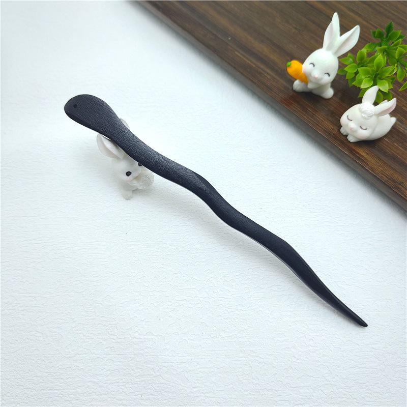 Элегантная шпилька из черного дерева: Современная простота в сочетании с древним китайским стилем