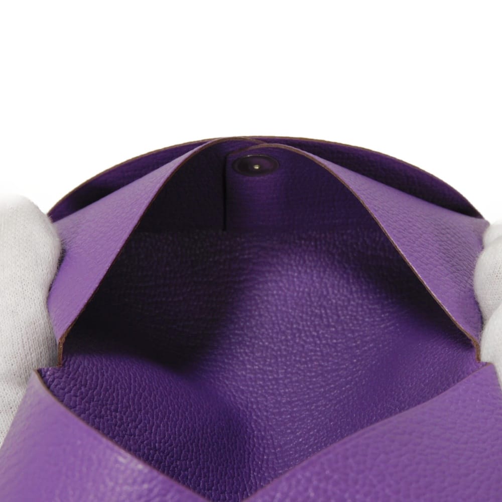 Used 9212 Calvi 7946 Chevre Mysore goatskin bag with gold-stamped logo and purple snap buttons. Excellent condition.
