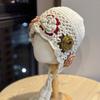 Korean-style handmade crochet floral knitted pullover hat for women, autumn and winter warm ethnic style travel photography hat with tassels and ear