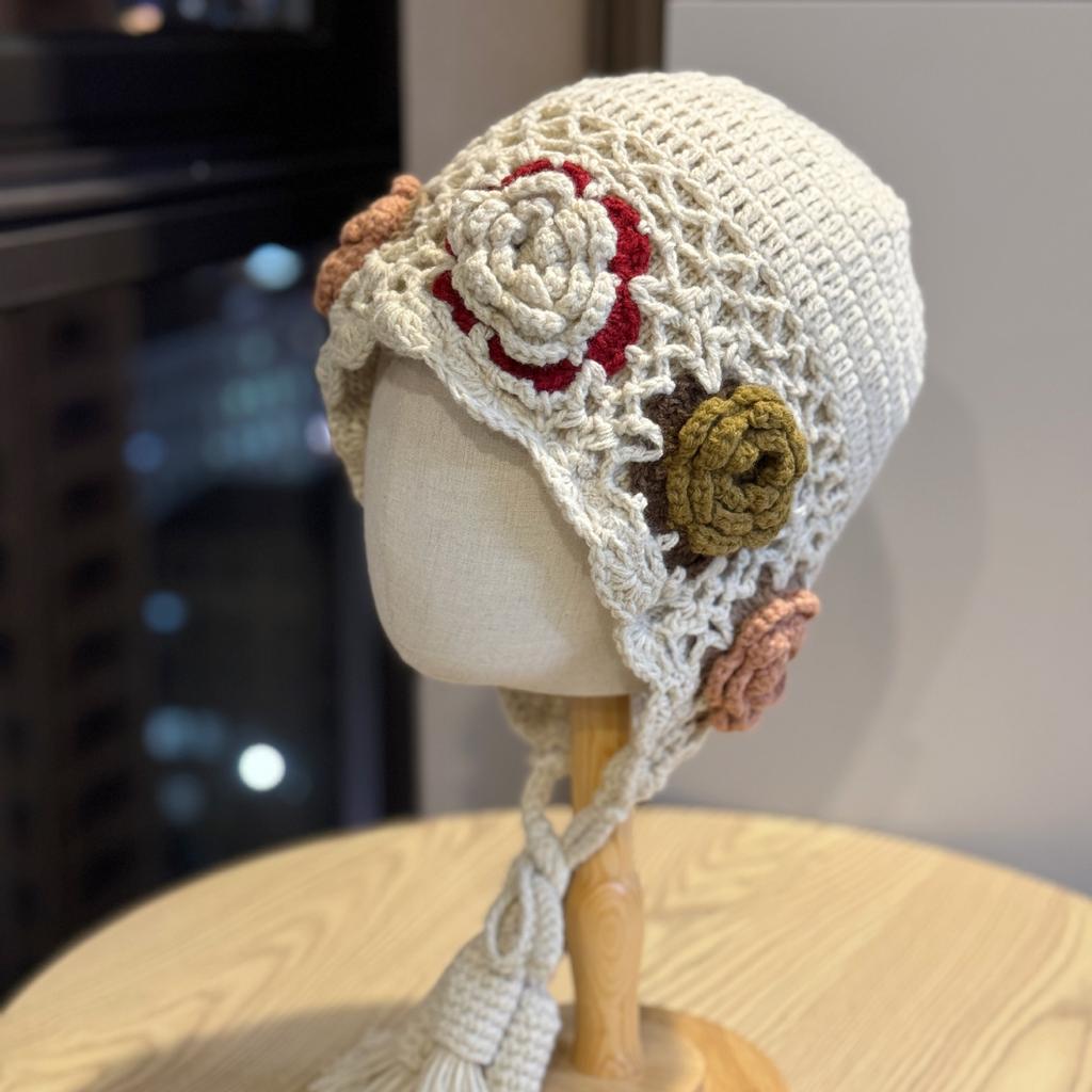Korean-style handmade crochet floral knitted pullover hat for women, autumn and winter warm ethnic style travel photography hat with tassels and ear