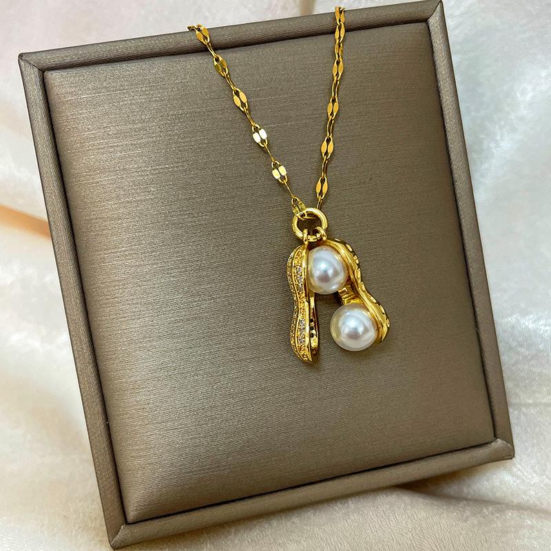 Позолоченная медь 18 карат, цепочка на ключицу с дизайном абака, тыквы-горлянки и лебедя.