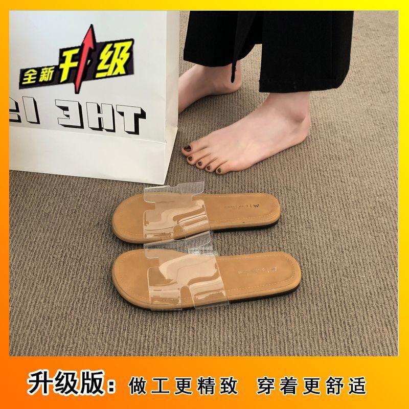2025 summer new fashion versatile beach vacation flat bottom drag French temperament flat bottom cool slippers transparent word belt