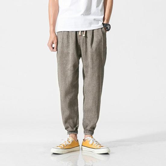 Весна Осень Мужские шаровары Шаровары Свободные завязывающиеся на шнурок эластичные карманы Глубокий шаговый шов с резинкой на щиколотке Однотонные спортивные брюки Повседневная одежда Спортивные брюки