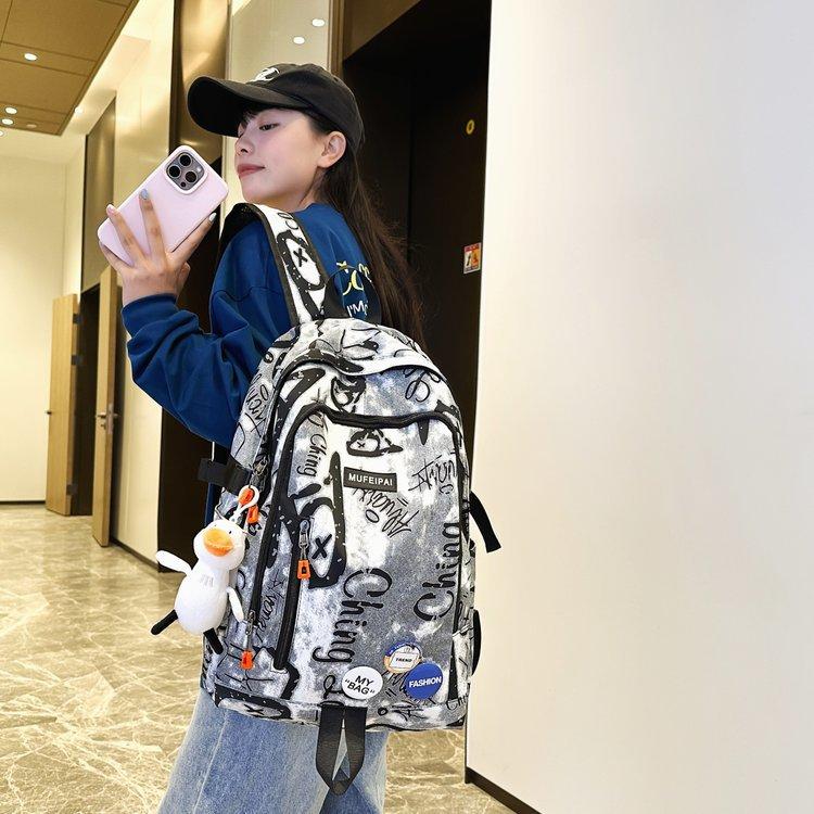 Schoolbag high value ins personality graffiti fashion large capacity trend casual schoolbag junior high school college student backpack