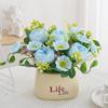 Living Room Decor: Artificial Sunflower and Green Plant Arrangements, Small Potted Plants, and Plastic Bouquets
