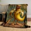 A humanoid banana holding a club in a jungle-like setting. for all seasons blanket lunch break throw gift