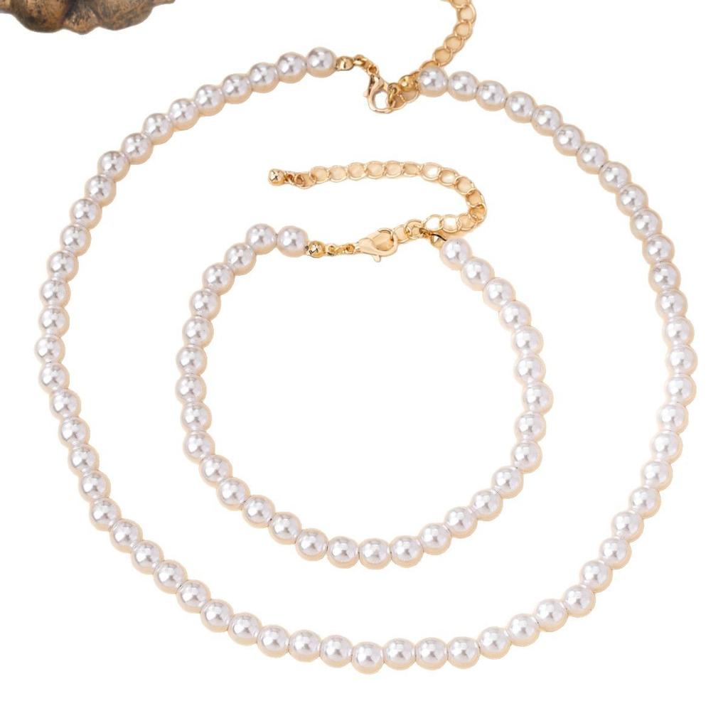 Комплект из трех предметов: ожерелье из искусственного жемчуга, браслет, серьги-пусеты. Модный женский жемчужный набор.