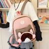 Cute Cartoon Trendy Backpack: Large Capacity, Lightweight, Versatile Travel/School Bag with Earphone and Doll Holder.