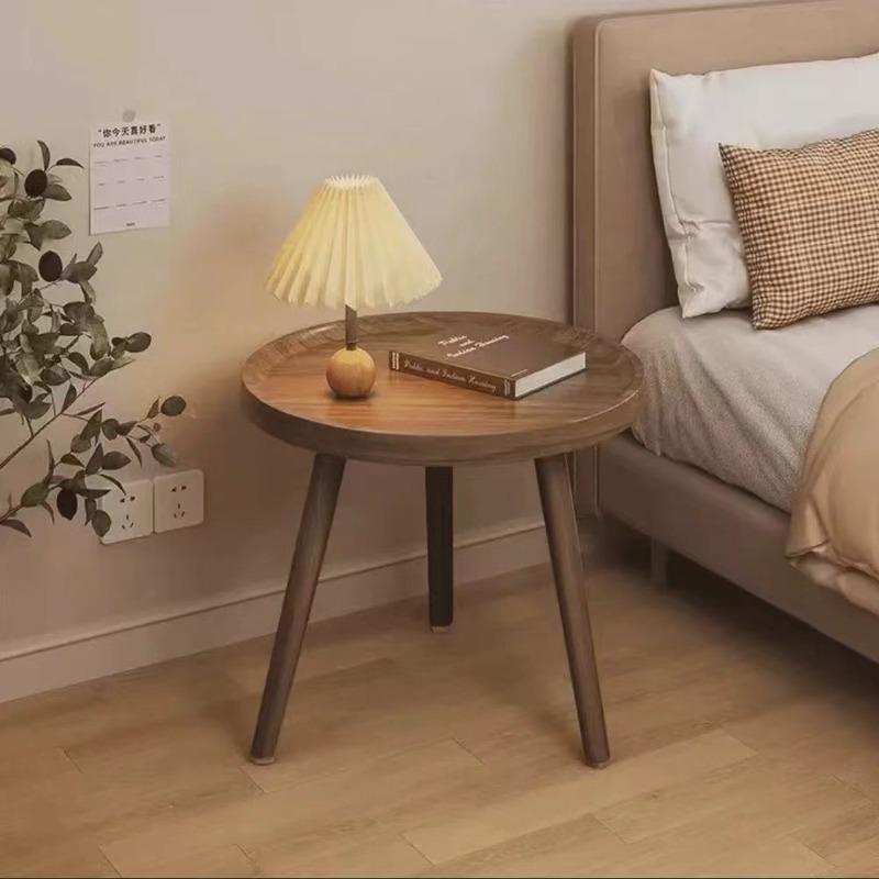 A Simple, Casual and Artistic Small Round Table Beside the Balcony Sofa, a Small Round Table and a Small Coffee Table