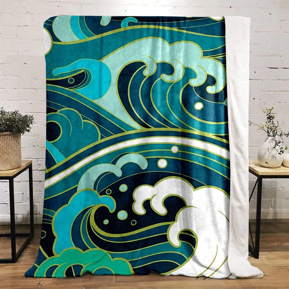 Stylized ocean waves in turquoise, white, and blue with gold outlines. for all seasons blanket lunch break throw gift