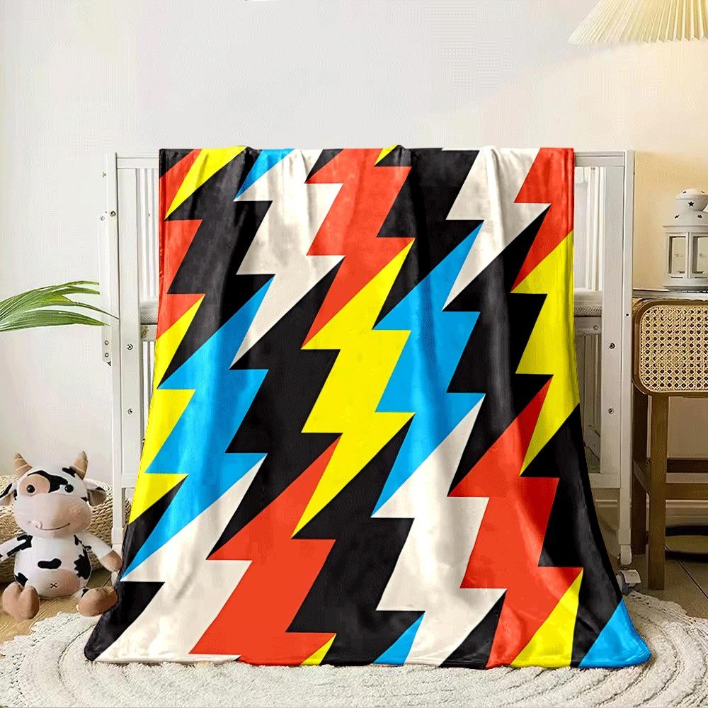 Zigzag lightning shapes in bold colors, including red, yellow, blue, and black. for all seasons blanket lunch break throw gift